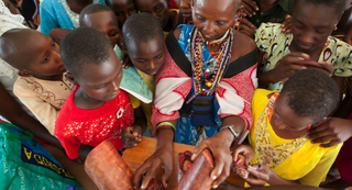 A Masai woman leads an exercise at an alternative rites of passage workshop in Magadi, Kenya (Anja Legtenberg)